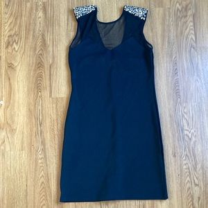 Little black dress with spiked sleeves